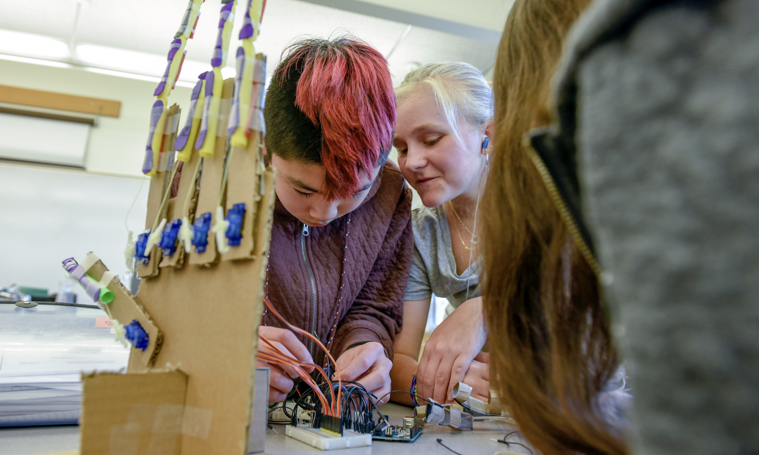 Kids at Beaverton SD work on an electronics kit.